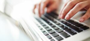 Person typing on a laptop