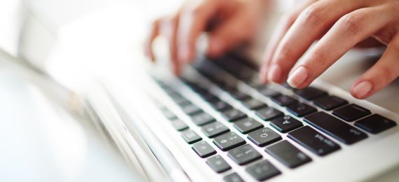 Person typing on a laptop